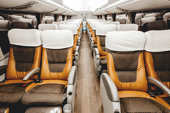 Coach bus service with leather chairs